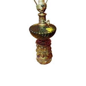 Vintage hollywood regency ornate brass and black and gold glass table lamp